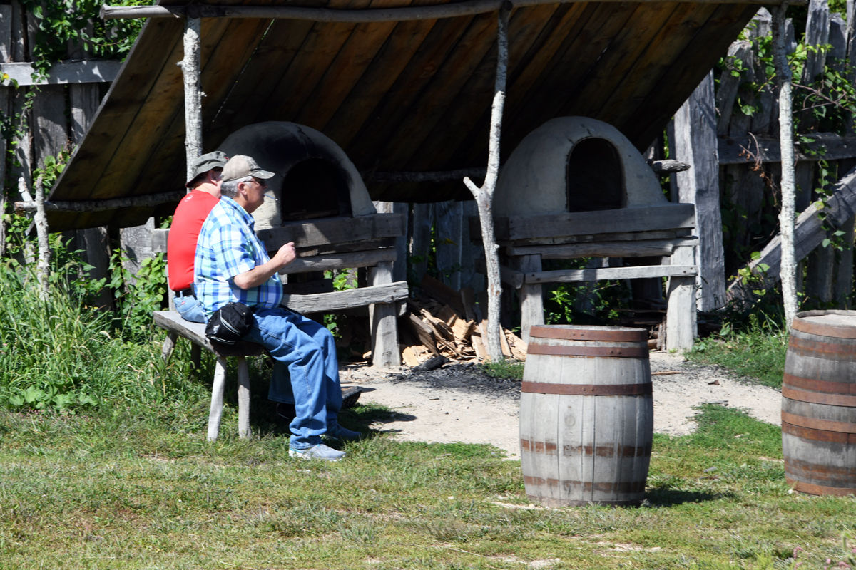 032 Dana Scott and Terry Willis relax as they observe the activities at Plimoth Plantation.jpg